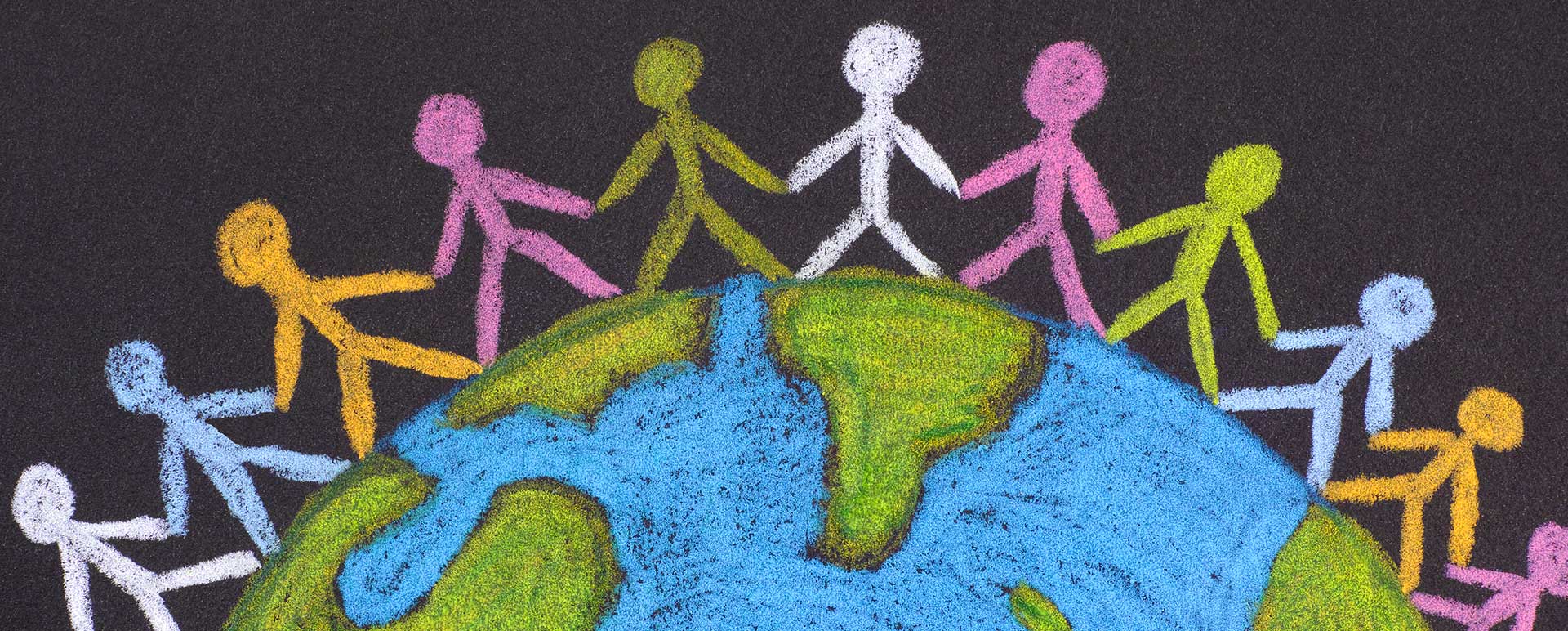 Crayon drawing of children holding hands around a globe